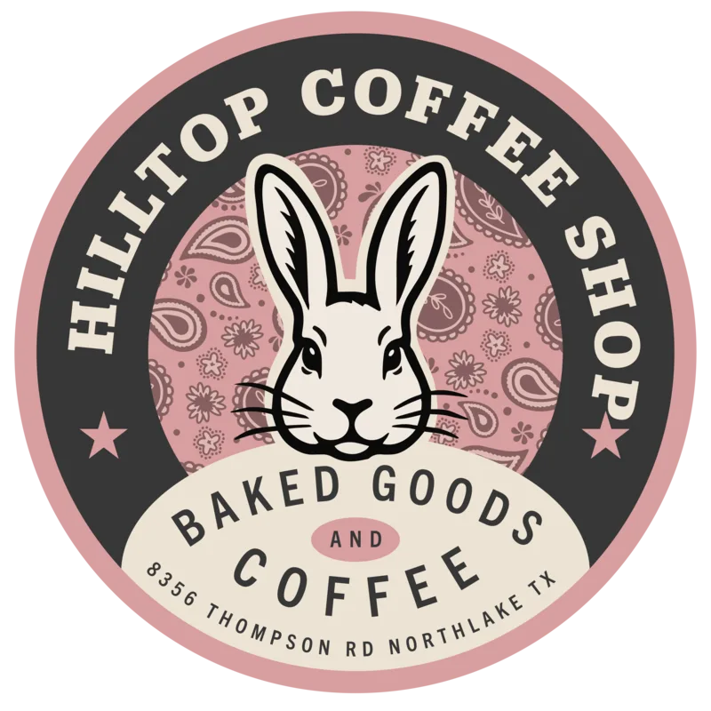 Hilltop Coffee Shop circular badge with a rabbit on a pink paisley field