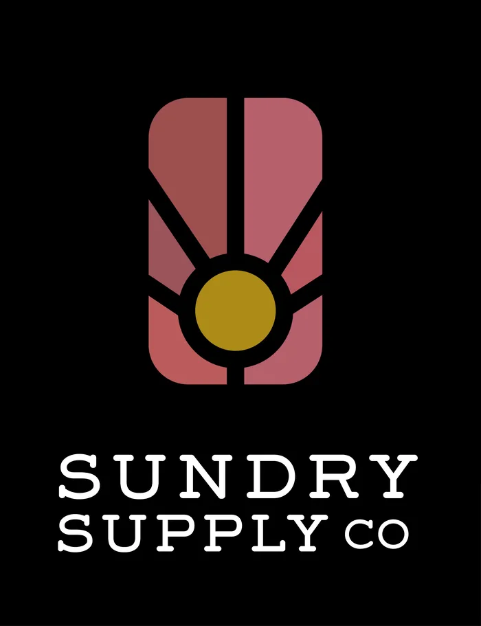 Sundry Supply Co mark: a rose arched window with a gold sun, above the wordmark